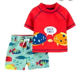 New with tags!Carter's swim trunk / rash guard set